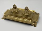 an image of a brass inkwell with two inkwells on it