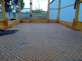 a picture of a construction site with a yellow crane