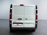 a white van that is parked in a room