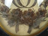 a picture of a clock with a bunch of flowers on it