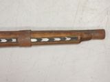 a wooden stick that has a pattern on it