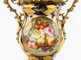 a vase with a painting of flowers on it