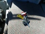 a car key sitting on the seat of a vehicle