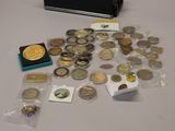 a suitcase full of coins and other items sitting on a table