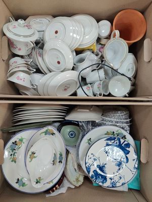 a box full of dishes and bowls in it