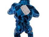 an image of a blue metal figure with a tag on it ' s chest
