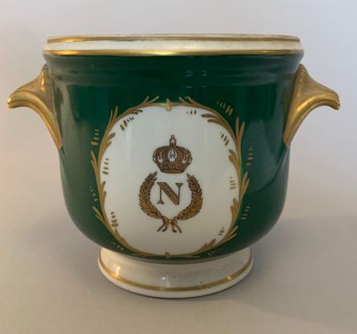 an image of a green and gold vase with a crown on it
