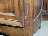 a wooden cabinet that has a door on it