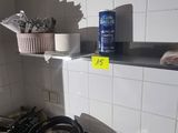 a pot and pan on the stove in the kitchen