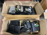 two boxes of electronic equipment sitting on the floor