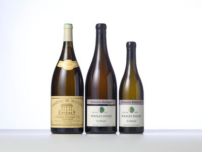 three bottles of wine sitting on top of a table next to each other