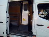 a van with the door open on the side of the road