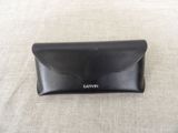 a close up of a black leather wallet case on a table