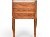 an image of a small wooden table with drawers on top of it
