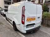 a white van that is parked on the side of the street