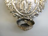 a silver plate with a picture of a woman and a child