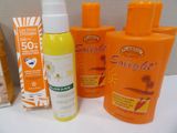 many sunscreens and lotion products on the counter