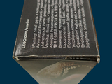 a close up of a box of toothpaste on a blue background