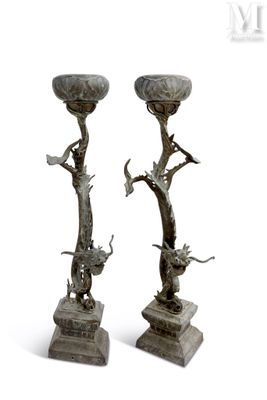 pair of bronze candlesticks with birds and flowers on them