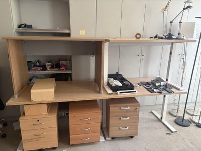 a desk with two drawers and a computer on it