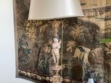a table with a lamp and a vase on it