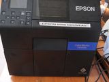 a printer that is sitting on a wooden table