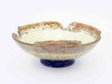 a glass bowl that is sitting on a table