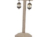 an image of a pair of earrings on a stand