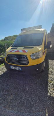 a yellow van that is parked on the side of the road