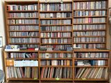 a large wooden bookcase filled with lots of books