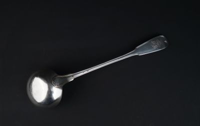 a spoon that is sitting on top of a black table