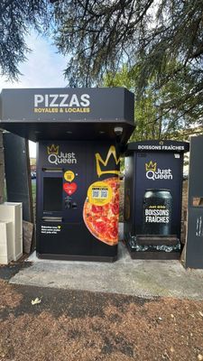 a vending machine with a crown on top of it