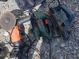 tools laid out on the ground on a sunny day