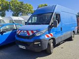 a blue van that is parked next to a blue car