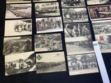 a lot of old black and white photos on the table