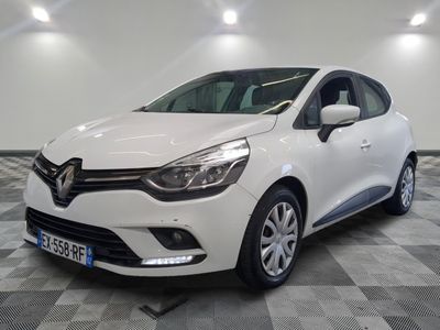 the white car is parked on a checkered floor in the garage