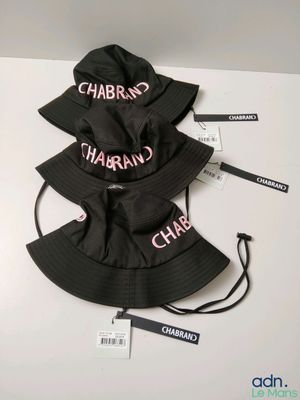 a couple of hats that are sitting on top of a table