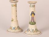 two vases that have been painted with people on them