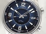 a close up of a watch on a white surface