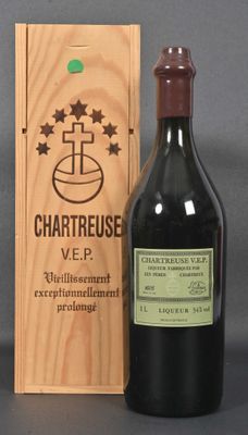 a bottle of wine in front of a wooden box