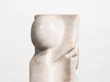 marble sculpture of a woman ' s head on a white surface