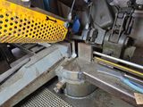 a machine that is working on a piece of metal