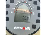 a close up of a speedometer on a table with a clock on it