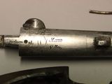 a close up of a metal object with writing on it