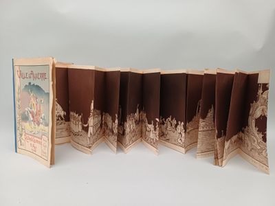 a folded book that has a picture of a city on it