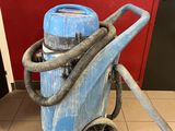 a blue machine that is sitting on the floor