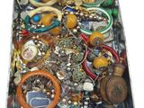 a box full of assorted jewelry on a table