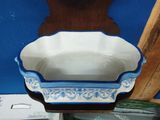a blue and white bowl sitting on top of a table