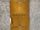 a piece of paper on the ground next to a yellow piece of paper