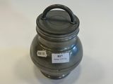 an image of a metal container with a lid on a white surface